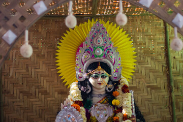 idol of hindu goddess saraswati being worshipped during saraswati puja festival in bengal.