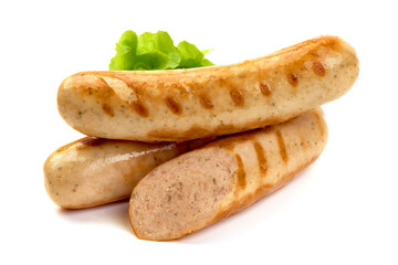 Grilled Bavarian sausages with green lettuce, isolated on white background.