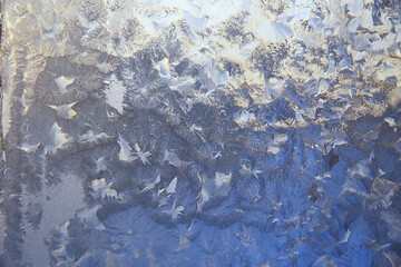 frost patterns on window glass, abstract background winter rime snow