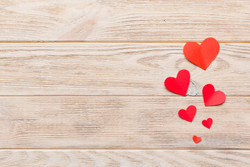 Obraz na płótnie Canvas Valentine day background with red hearts, top view with copy space