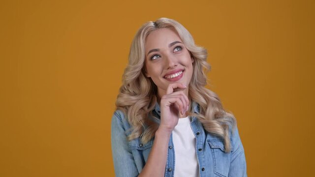 Interested lady touch finger chin think isolated shine color background