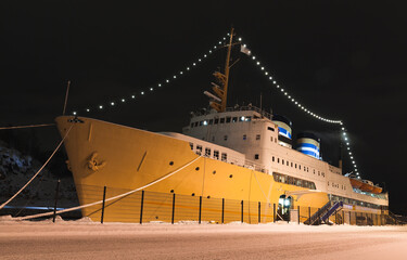 Vintage passenger ferry ship with yellow hull