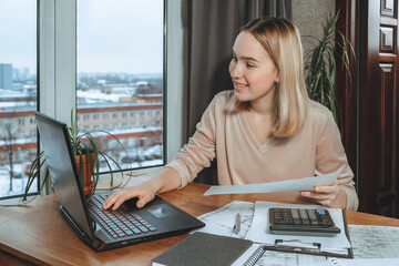 Investments. Young woman investor buys stocks on the stock exchange stock market from home. Generation z invests budget analyzes income of digital money. Cryptocurrency trading. Investor freelancing