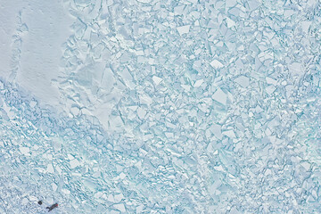 Fototapeta na wymiar ice hummocks baikal top view texture, abstract background winter broken ice