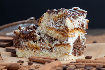a multi-layered cake made of chocolate and cream cakes