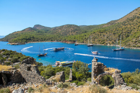 Brown gulet moored in Aegean Sea - &Ouml;l&uuml;deniz Beach and aquarium kyou, &Ouml;l&uuml;deniz Beach Turkey's best beaches - Fethiye, Turkey