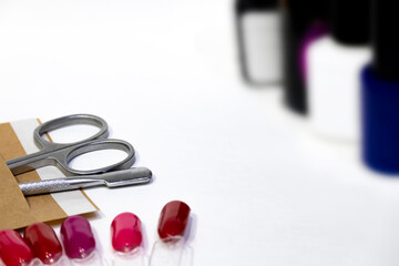 Manicure, pedicure background with professional metal sterile cuticle removal tools. Pusher, nail...