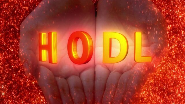 Hands holding "HODL" meme text on a digital binary red background as the famous quote "Hold" means to hold on to financial assets, shares or cryptocurrency NFT, coin, and tokens during a bear market.