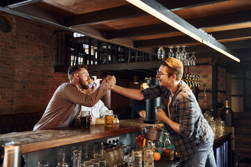 Facial expression. People in casual clothes sitting in the pub