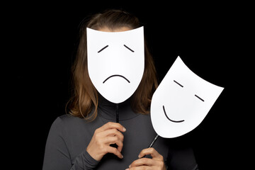 Theatrical mask in the form of a smiling and sad face.