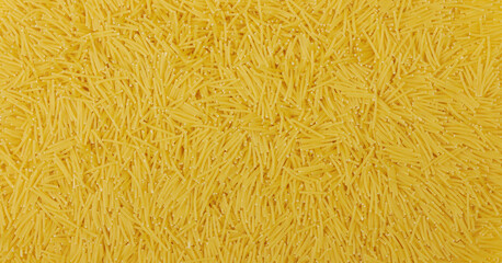 Uncooked vermicelli pasta background and texture