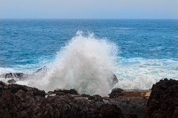 Fototapeta na wymiar the sea stumbles over the rocks in its path