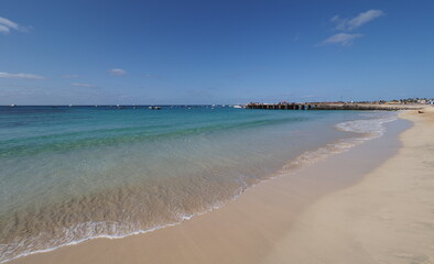 Sandy seaside with boats on Atlantic Ocean at Sal island, Cape Verde