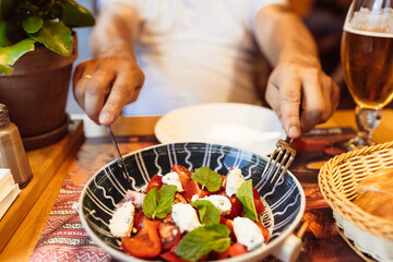 person eating salad