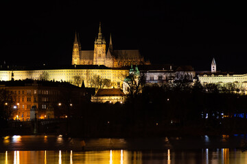 Fototapeta na wymiar Night Prague, view of the Vitus Cathedral against the background of a dark sky, cityscape