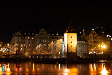 Fototapeta na wymiar Night Prague, cityscape, reflection of night lights in the Vltava river