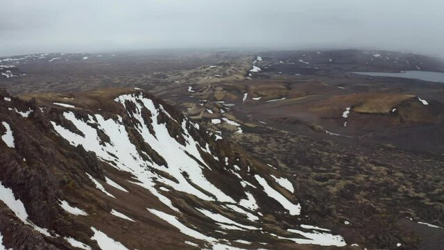 Snowy Cliff Of Mountain Near Laki A Volcanic Fissure In Iceland. - aerial