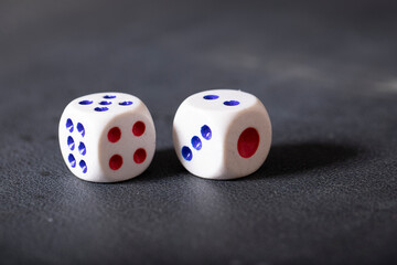 two dice on a black background