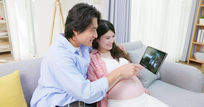 asian pregnant couple together
