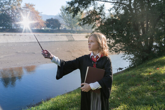  Witch Girl With Magic Wand Cosplay Harry Potter Wizzard Outdoor. Halloween Holiday. Halloween Costume.