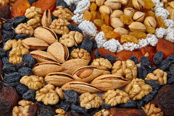 Dried fruits of zucats and nuts are posted on the table