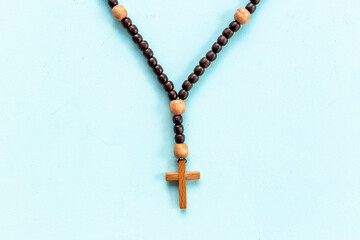 Fototapeta premium Christian rosary beads with wooden cross. Religion concept