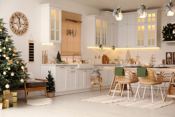 Cozy open plan kitchen decorated for Christmas. Interior design