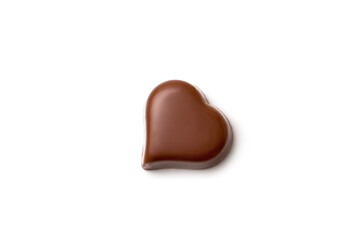 Chocolate heart-shaped candy on white background