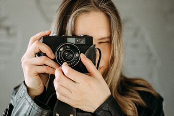 Beautiful girl with Vintage Photo Camera 