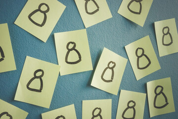 Drawn people figures on the stickers as symbol of customers or employee.