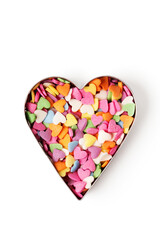Multi-colored heart-shaped pastry topping in heart form on white background
