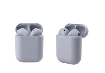 Two grey wireless headphones in a case on a white background