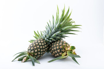 Fototapeta premium Two pineapple on the white background. fruit in Thailand.