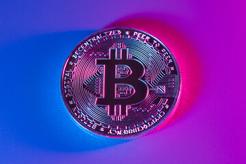 Bitcoin electronic virtual cryptocurrency for online banking. Business currency technology concept. Close up macro view. Stock market. Beautiful purple and pink color