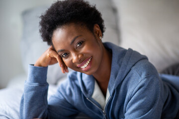 Close up beautiful young african american woman smiling and looking at camera