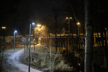 gravel trail at night illuminated with city light