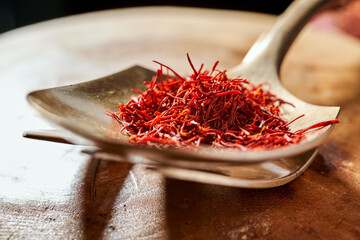 saffron threads on a copper spoon close-up