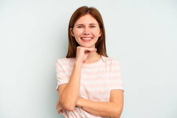 Young English woman isolated on blue background smiling happy and confident, touching chin with hand.