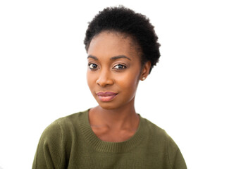 Close up beautiful young African American woman with serious expression on face against isolated...