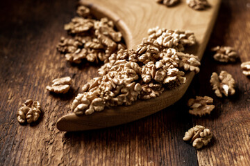 Peeled walnuts. On a wooden board. Healthy food. Natural background.