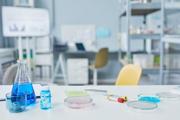 Close-up of table with test tubes with samples and analysis for scientific experiment in the laboratory