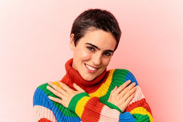 Young caucasian woman isolated on blue background