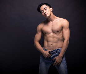 Fototapeta na wymiar Portrait of young asian bodybuilder man.