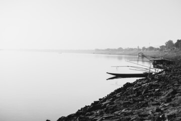 High key beautiful background black and white for mekong riverside in the morning with fishing boat
