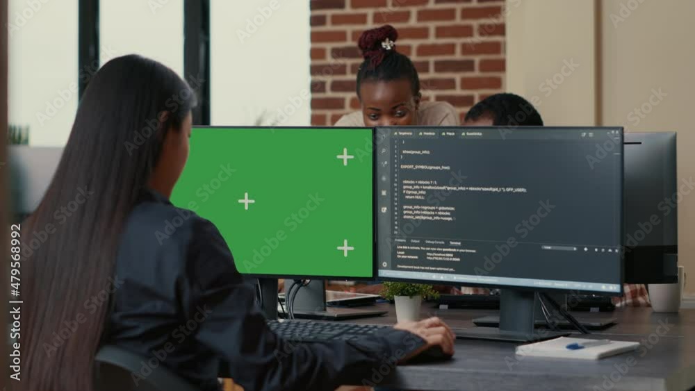 Wall mural software developer writing algorithm in front of computer with green screen chroma key mockup in ai 