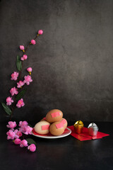 Chinese new year festival decorations pow or red packet, orange and gold ingots or golden lump on a...