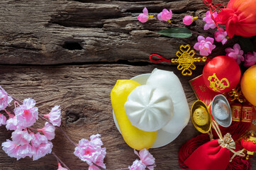 Chinese new year festival decorations pow or red packet, orange and gold ingots or golden lump on a...