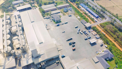 Aerial top view of factory industry. Electricity tower building in energy, transportation, logistic or environment concept. Manufacturing workshop station.