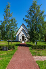 Fototapeta na wymiar White countryside church in a lush green summer Sweden