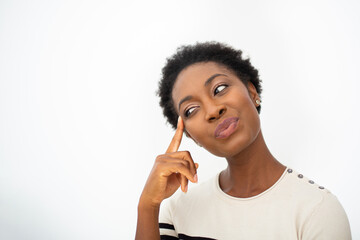 Close up young African American woman thinking with finger to head by white isolated background